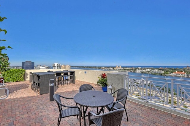 view of patio with a water view