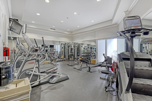 gym with a raised ceiling