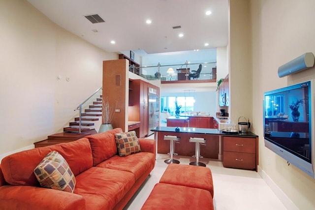 living room with a high ceiling