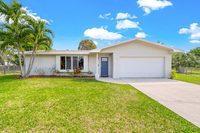 ranch-style house featuring a front lawn and a garage