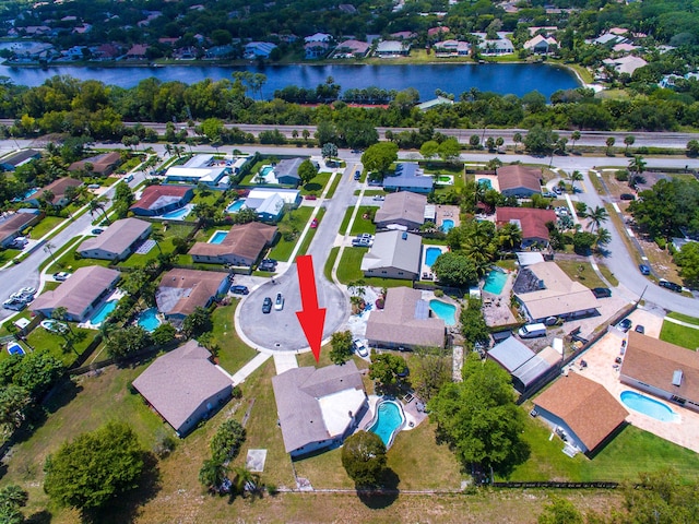 birds eye view of property featuring a water view