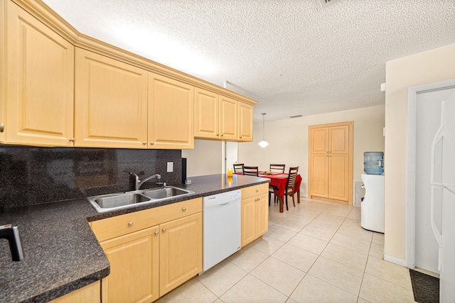 kitchen featuring decorative light fixtures, tasteful backsplash, sink, white appliances, and light tile floors