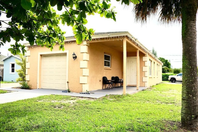 exterior space with a garage and a yard