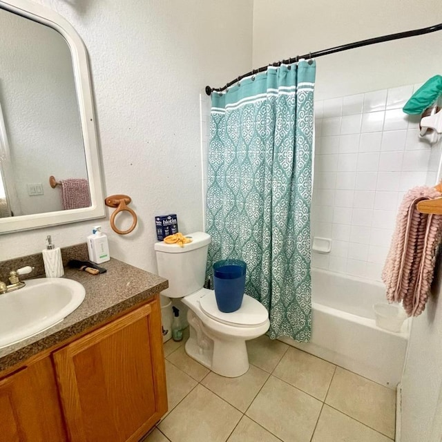 full bathroom featuring shower / bath combination with curtain, vanity, toilet, and tile patterned floors