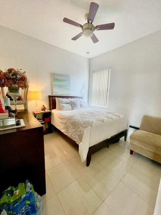 bedroom with light tile patterned flooring and ceiling fan