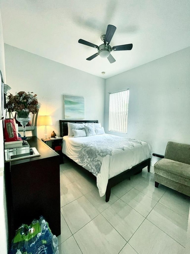 tiled bedroom with ceiling fan