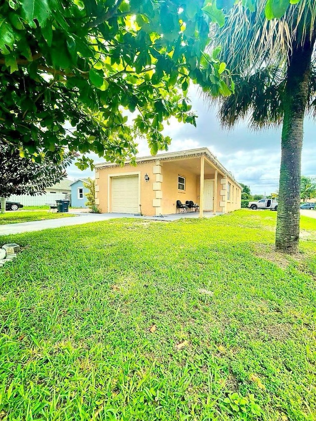 view of front facade with a front lawn and a garage