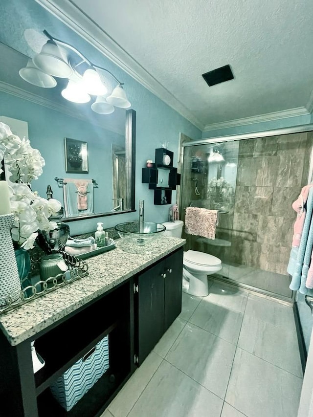 bathroom featuring crown molding, a shower with door, vanity, and toilet