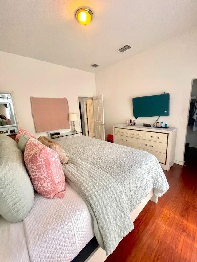 bedroom featuring dark hardwood / wood-style floors