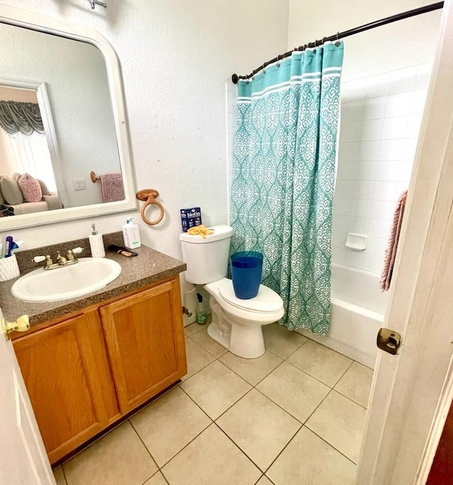 full bathroom with shower / tub combo with curtain, vanity, toilet, and tile patterned flooring