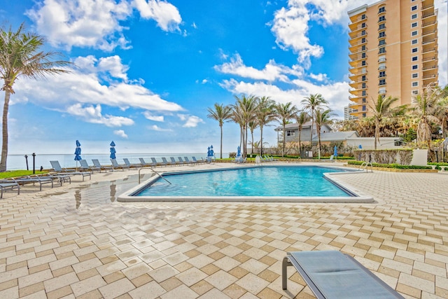 view of swimming pool with a patio