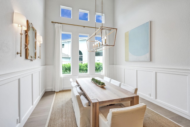 dining room with an inviting chandelier and light wood-type flooring