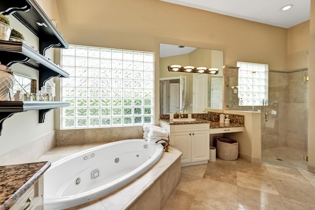 bathroom featuring tile patterned floors, separate shower and tub, and vanity