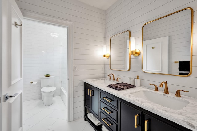 full bathroom featuring vanity, tile walls, tile patterned flooring, and toilet