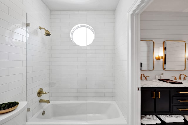 full bathroom with vanity, toilet, and tiled shower / bath