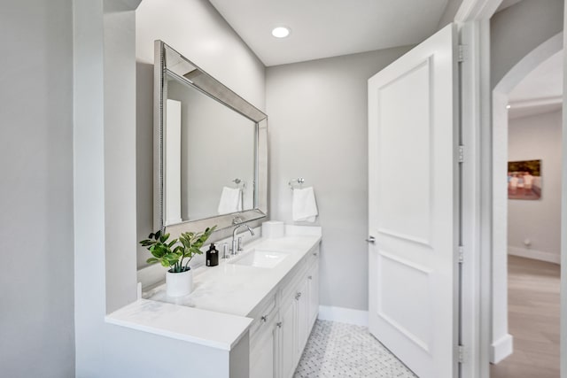 bathroom with hardwood / wood-style floors and vanity