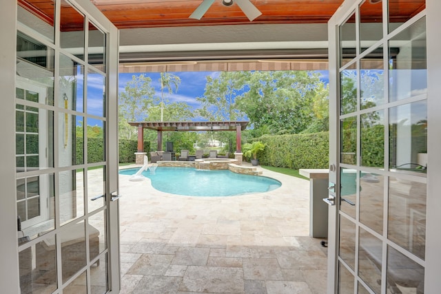 view of pool featuring an in ground hot tub, ceiling fan, and a patio