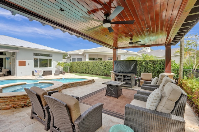 view of patio featuring ceiling fan, a pool with hot tub, and an outdoor hangout area