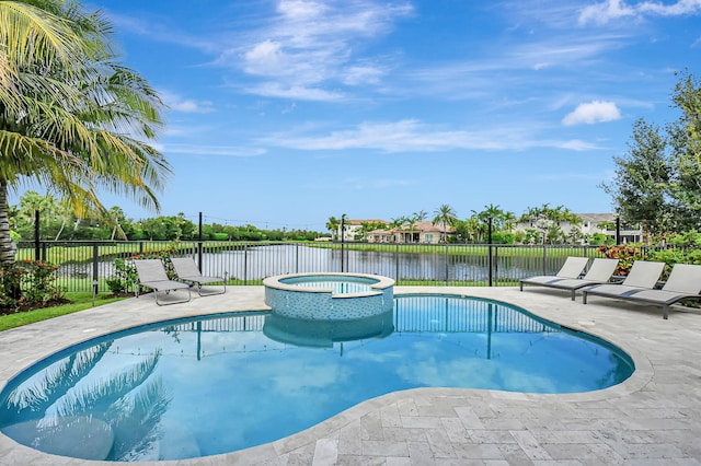 view of pool featuring a patio area and an in ground hot tub