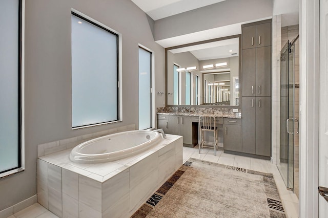 bathroom featuring tile flooring, vanity, and plus walk in shower