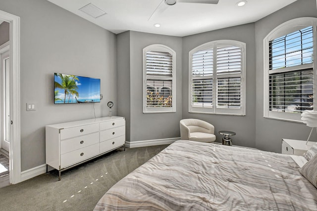 bedroom featuring ceiling fan and dark colored carpet