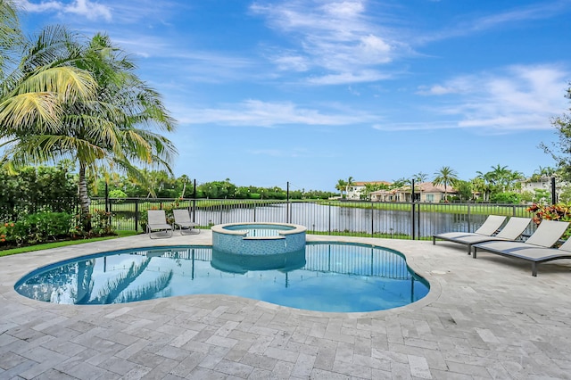 view of swimming pool with an in ground hot tub and a patio area