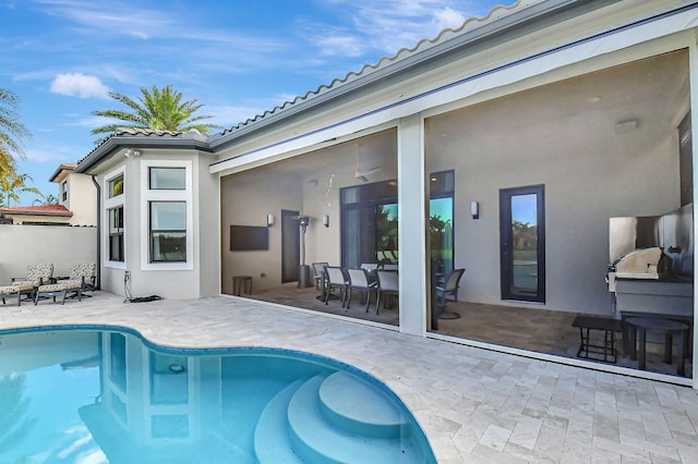 view of swimming pool with a patio area