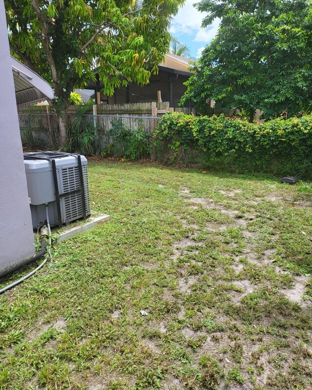 view of yard featuring central AC unit