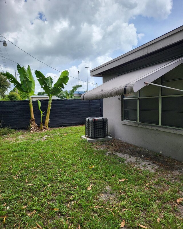 view of yard featuring central AC unit