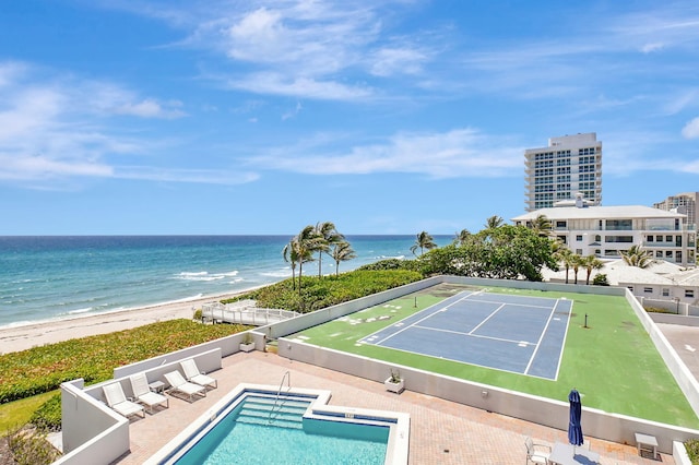 exterior space with a beach view and a water view