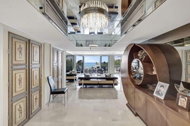 hallway with light tile patterned floors and an inviting chandelier