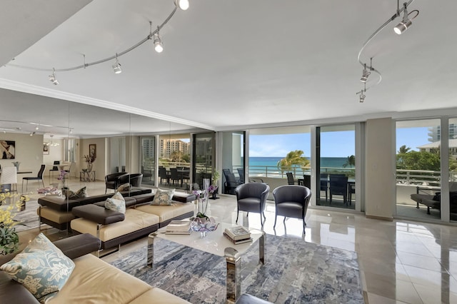 living room featuring light tile patterned floors and a water view