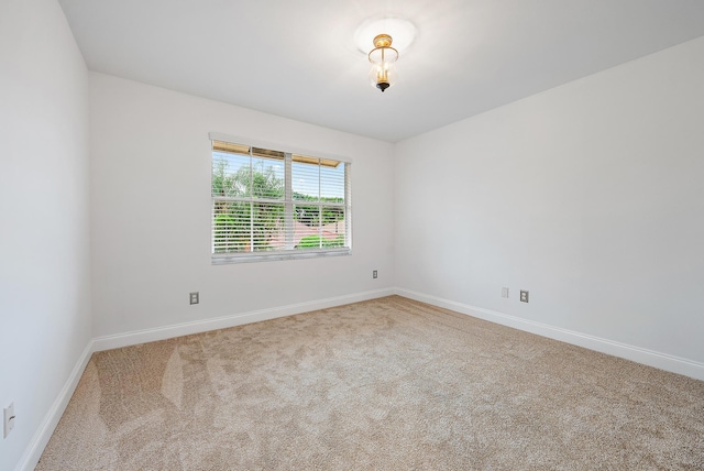 unfurnished room featuring carpet flooring