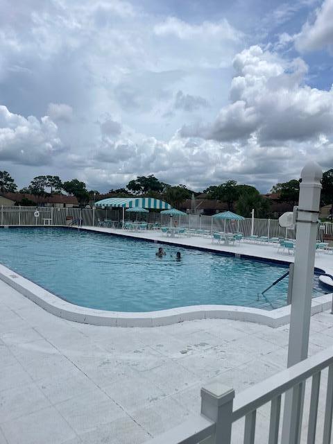 view of swimming pool with a patio