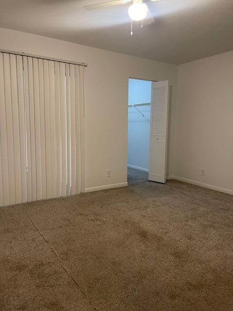 unfurnished bedroom featuring ceiling fan