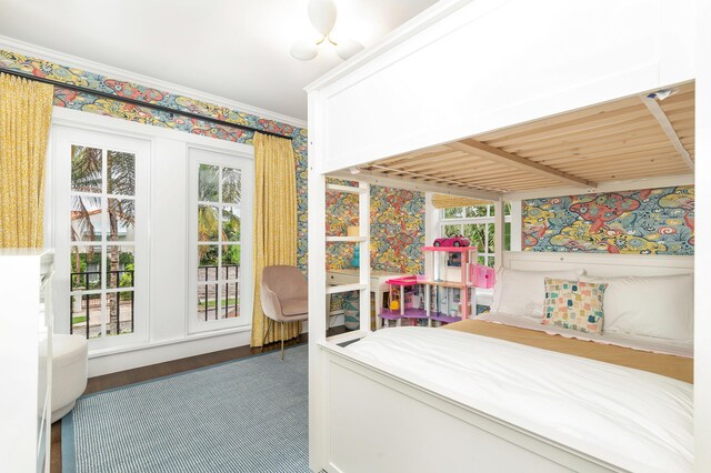 unfurnished bedroom featuring hardwood / wood-style flooring and ornamental molding