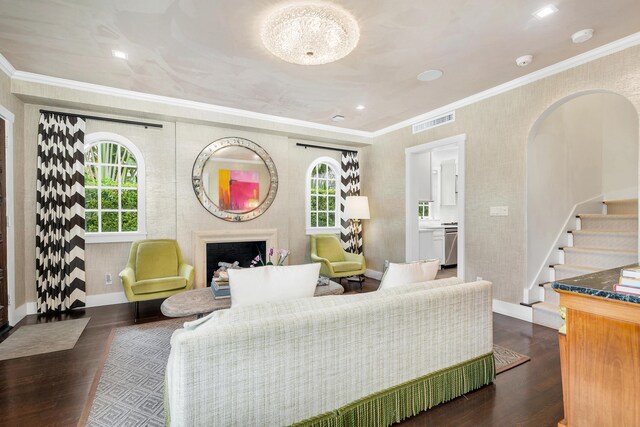 living room featuring dark hardwood / wood-style flooring and crown molding