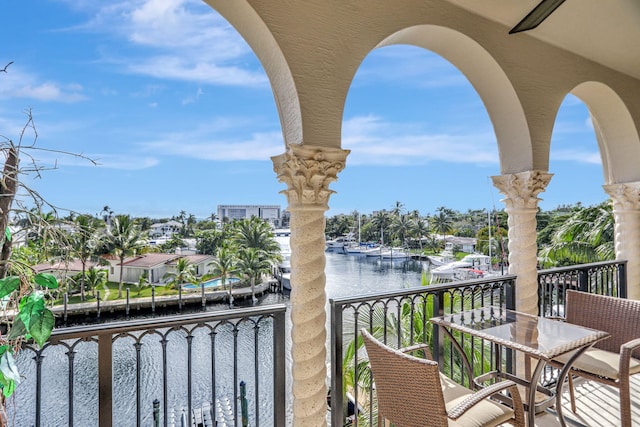 balcony featuring a water view