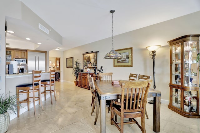 dining space featuring baseboards, visible vents, and recessed lighting