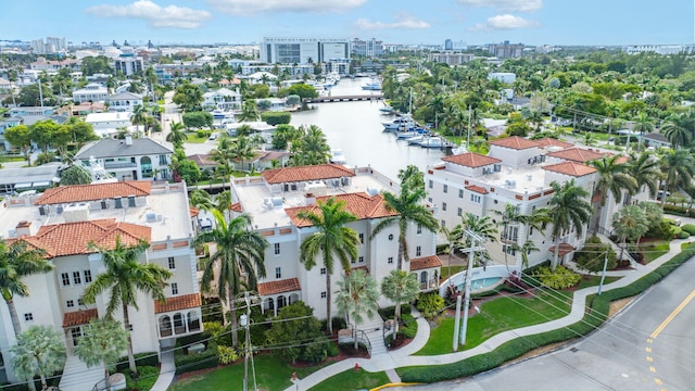 birds eye view of property with a view of city and a water view