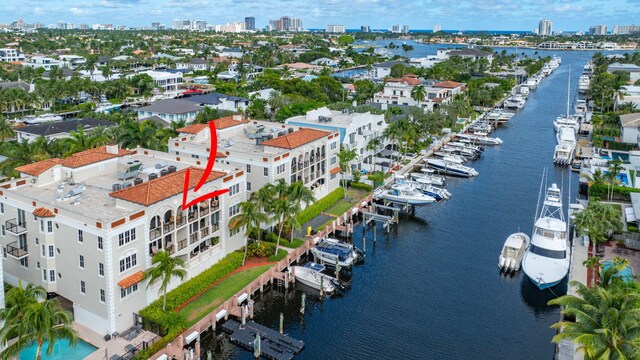 birds eye view of property with a water view