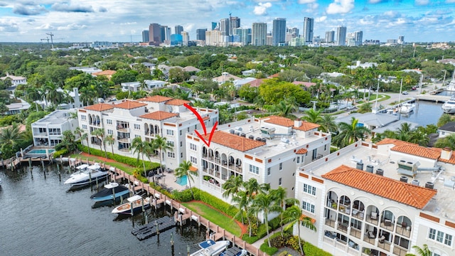 birds eye view of property with a water view