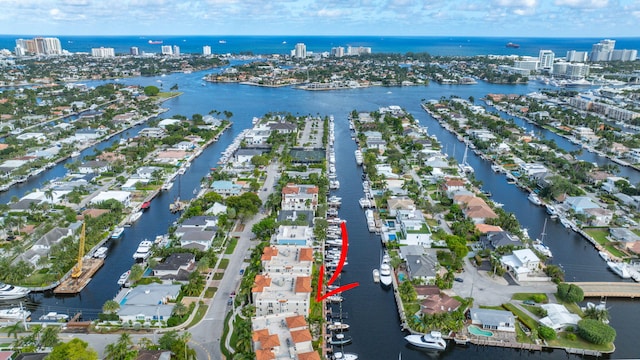 birds eye view of property with a water view