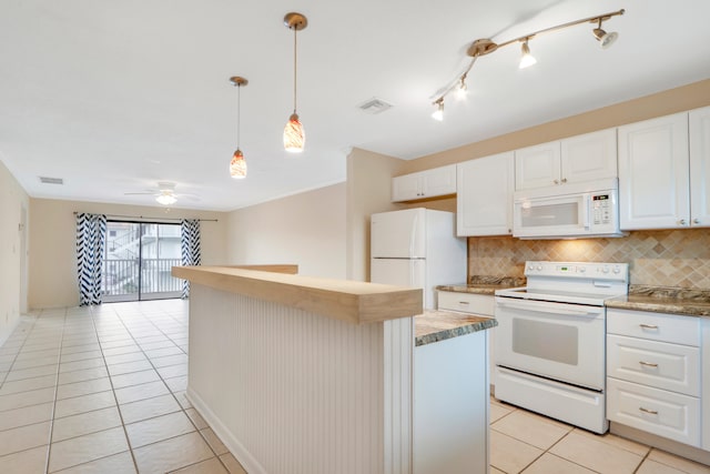 kitchen with white appliances, white cabinetry, hanging light fixtures, and backsplash