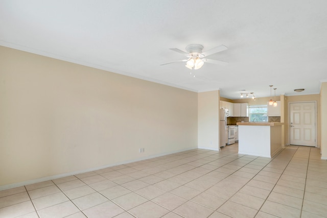 unfurnished living room with ceiling fan, ornamental molding, and light tile patterned flooring