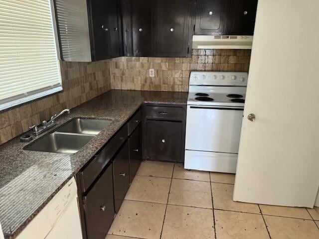 kitchen featuring backsplash, sink, ventilation hood, white appliances, and light tile floors