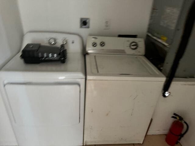 laundry area featuring washing machine and clothes dryer