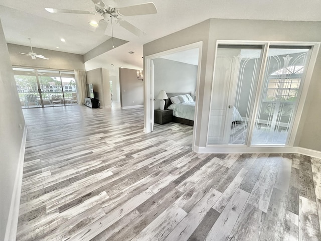 interior space with light hardwood / wood-style flooring and ceiling fan