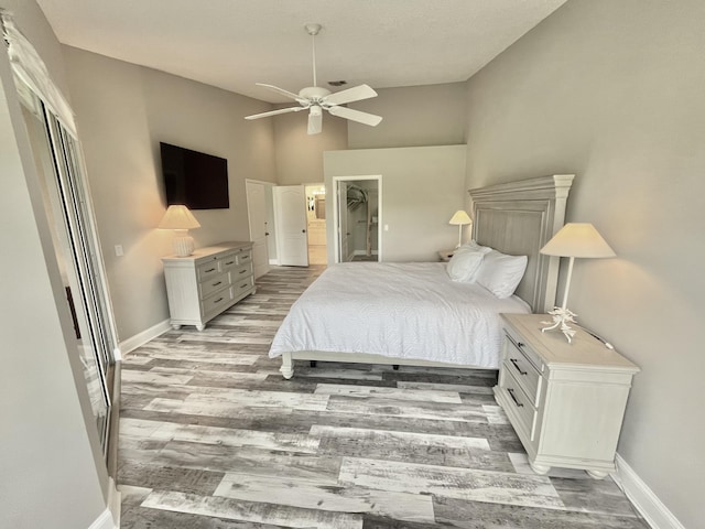 bedroom featuring hardwood / wood-style flooring and ceiling fan