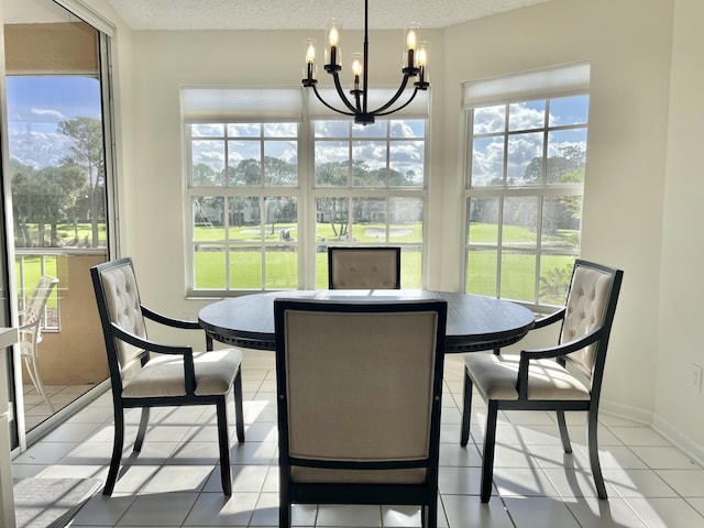 sunroom / solarium featuring an inviting chandelier